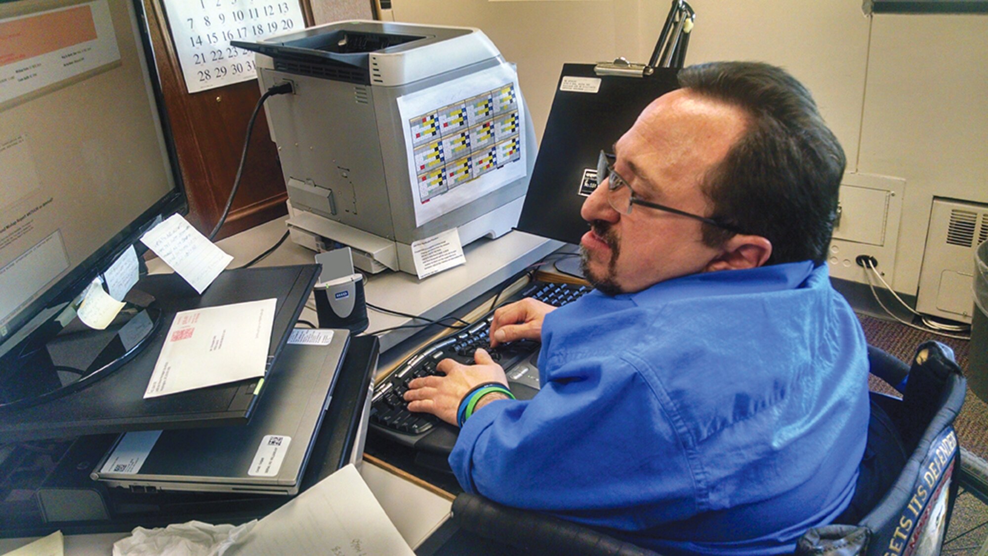 Christopher Gitto, a technical information specialist with the Air Force Safety Center, was recently named the Air Force winner of the Department of Defense Outstanding Employee with a Disability Award. (Photo by Ryan Stark)