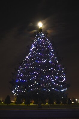 The Joint Base Andrews’ Christmas tree lights up the sky after the Christmas Tree and Hanukkah Menorah Lighting on JBA, Dec. 3, 2014. The lighting is an annual event kicking off the holiday season. (U.S. Air Force photo/ J.D. Maidens)