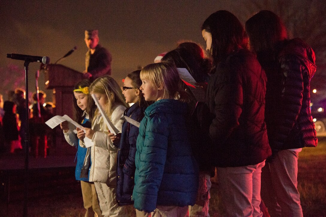 A local Girl Scouts’ choir sings during the arrival of Santa Claus during the Christmas Tree and Hanukkah Menorah Lighting on Joint Base Andrews, Dec. 3, 2014. The choir sang “Santa Claus is Coming to Town.” (U.S. Air Force photo/ J.D. Maidens)