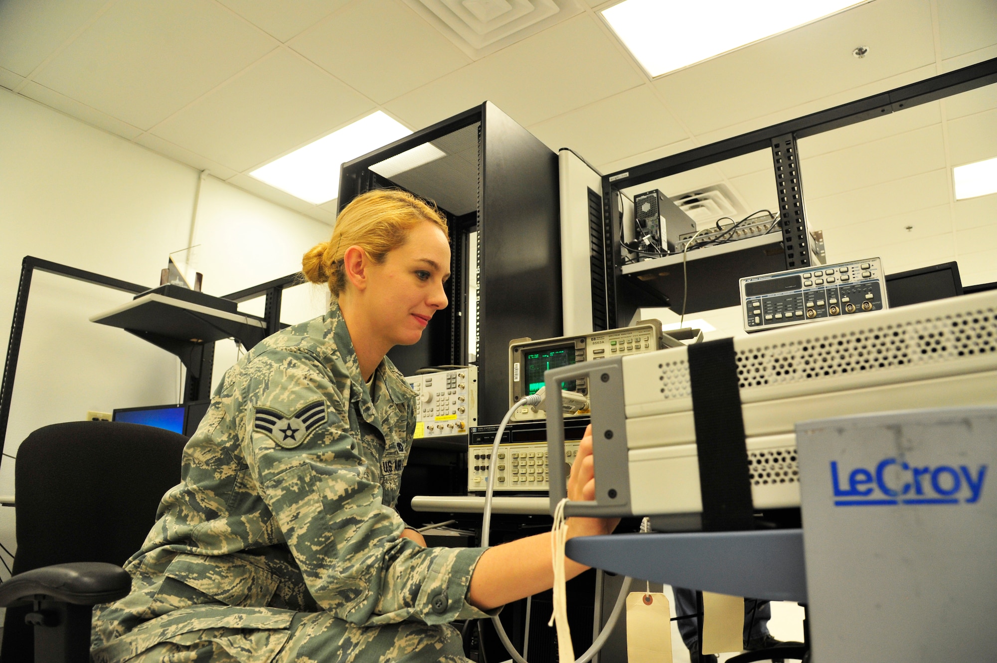 Senior Airman Kayleigh McGill, 56th CMS PMEL journeyman, inputs a signal from a known reference source, which checks the cumulative error over the entire power scale of a spectrum analyzer. PMEL Airmen calibrate anything from torque wrenches, pressure gauges, weights and scales. (U.S. Air Force photo/Senior Airman Grace Lee)