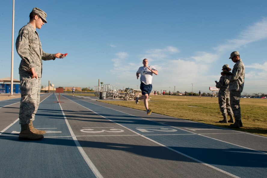 Staff Sgt. Seth Barrett, 56th Logistics Readiness Squadron vehicle technician, finishes the run portion of his Air Force physical fitness test Nov. 12 at Luke Air Force Base. Barrett raised his score by more than eight points after completing a run improvement program ran by the base exercise physiologist. (U.S. Air Force photo/Staff Sgt. Staci Miller)
