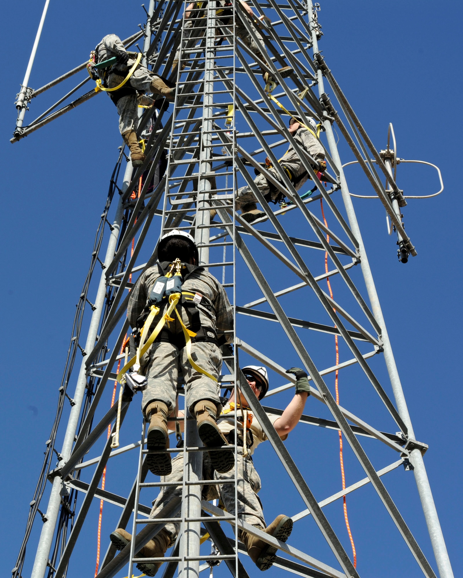 Airmen from the 2nd Communications Squadron conduct climbing and rappelling certification on Barksdale Air Force Base, La., Nov. 19, 2014. The certification is an annual requirement for cable and antenna technicians. (U.S. Air Force photo/ Senior Airman Jannelle Dickey)