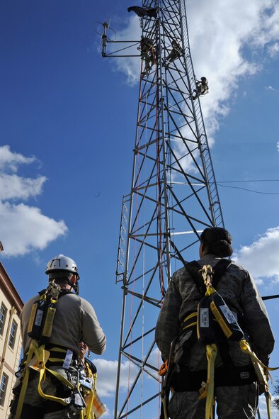 Airmen from the 2nd Communications Squadron conduct climbing and rappelling certification on Barksdale Air Force Base, La., Nov. 19, 2014. The certification is an annual requirement for cable and antenna technicians. (U.S. Air Force photo/ Senior Airman Jannelle Dickey)