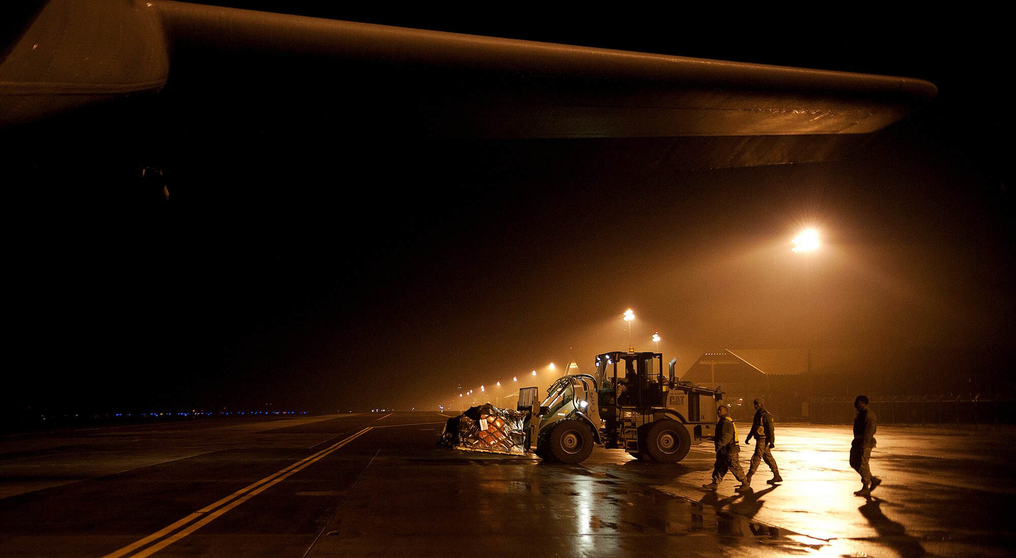 Airmen load cargo onto a C-130 Hercules during exercise Beverly Sunrise 15-1 at Misawa Air Base, Japan, Dec. 3, 2014. Beverly Sunrise 15-1 was Misawa’s first exercise to be conducted under the Commander’s Inspection Program, which allows commanders to shape their exercises to ultimately help units execute their mission more effectively. (U.S. Air Force photo by Airman 1st Class Jordyn Rucker/Released)