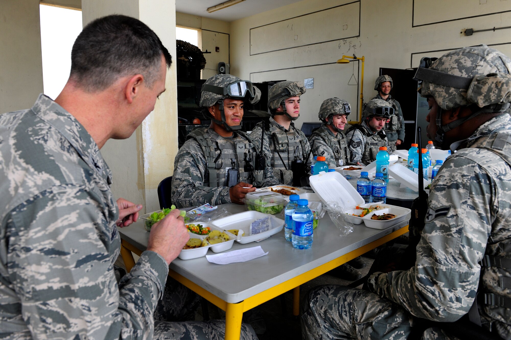Col. Craig Wills, 39th Air Base Wing commander, eats lunch with 39th Security Forces Squadron Airmen, Dec. 2, 2014, at Incirlik Air Base, Turkey. Wills dined with Airmen to mark the first day of a new carry-out meal service for security forces members who cannot leave their post to go to the dining facility. (U.S. Air Force photo by Senior Airman Krystal Ardrey/Released)