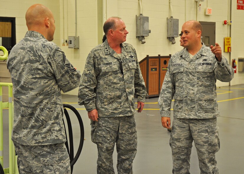 Tech. Sgt. Jason Barefield, a 592nd Special Operations Maintenance Squadron crew chief, updates visiting Maj. Gen. Eugene Haase, Air Force Special Operations Command vice commander, on the status of C-145 maintenance at Duke Field, Fla.  The active-duty 592 SOMXS partners with reservist 919th Maintenance Group Airmen to ensure the airworthiness of Duke's AFSOC-owned fleet as they support special operations combatant commanders around the globe. (U.S. Air Force photo/Dan Neely)