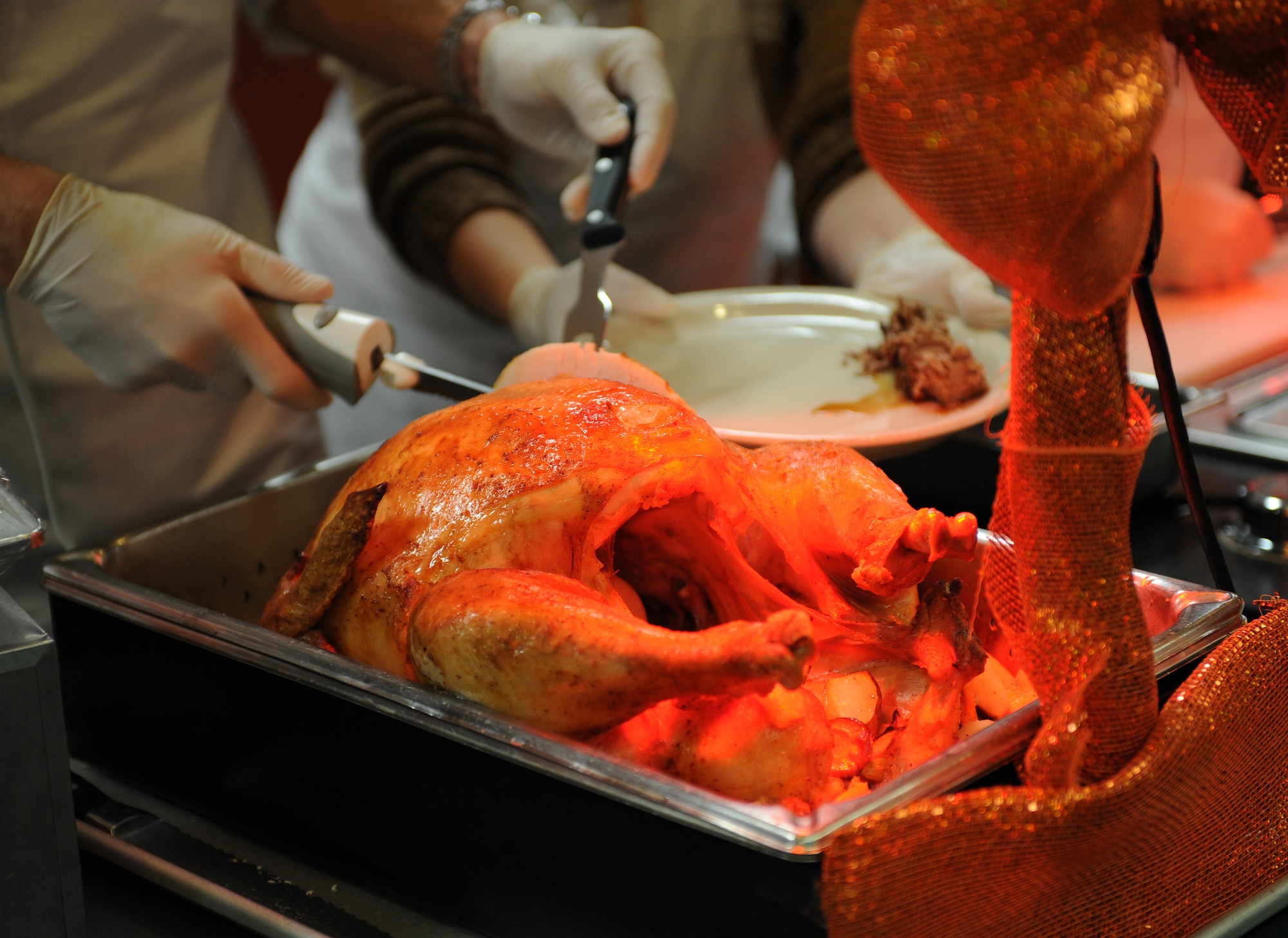 Col. Matthew Brooks, 509th Bomb Wing vice commander, serves a piece of turkey during the Ozark Inn dining facility’s Thanksgiving day meal Nov. 27, 2014 at Whiteman Air Force Base, Mo. Whiteman’s senior leaders also served ham,  mashed potatoes and other Thanksgiving dishes to customers. (U.S. Air Force photo by Airman 1st Class Joel Pfiester/Released)
