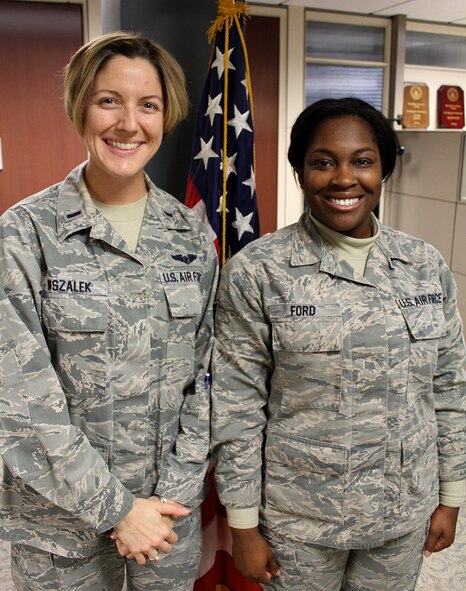 First Lt. Liz Wszalek and Staff Sgt. Reonna Ford smile after a special reenlistment ceremony last week.  Lt. Wszalek performed the oath of enlistment for Staff Sgt. Reonna Ford who signed up for several additional years with the Air Force Reserve Command. She was excited and happy during the short ceremony. "The military has been an important part of my life for the last 8 years. I am honored to serve my country and decided to re-enlist for two more years. I am very thankful for the wonderful opportunities that came with joining the Air Force. I have obtained my education, a great career, and met many wonderful people along the way," said Staff Sergeant Reonna Ford. (U.S. Air Force photo/Maj. Stan Paregien) 