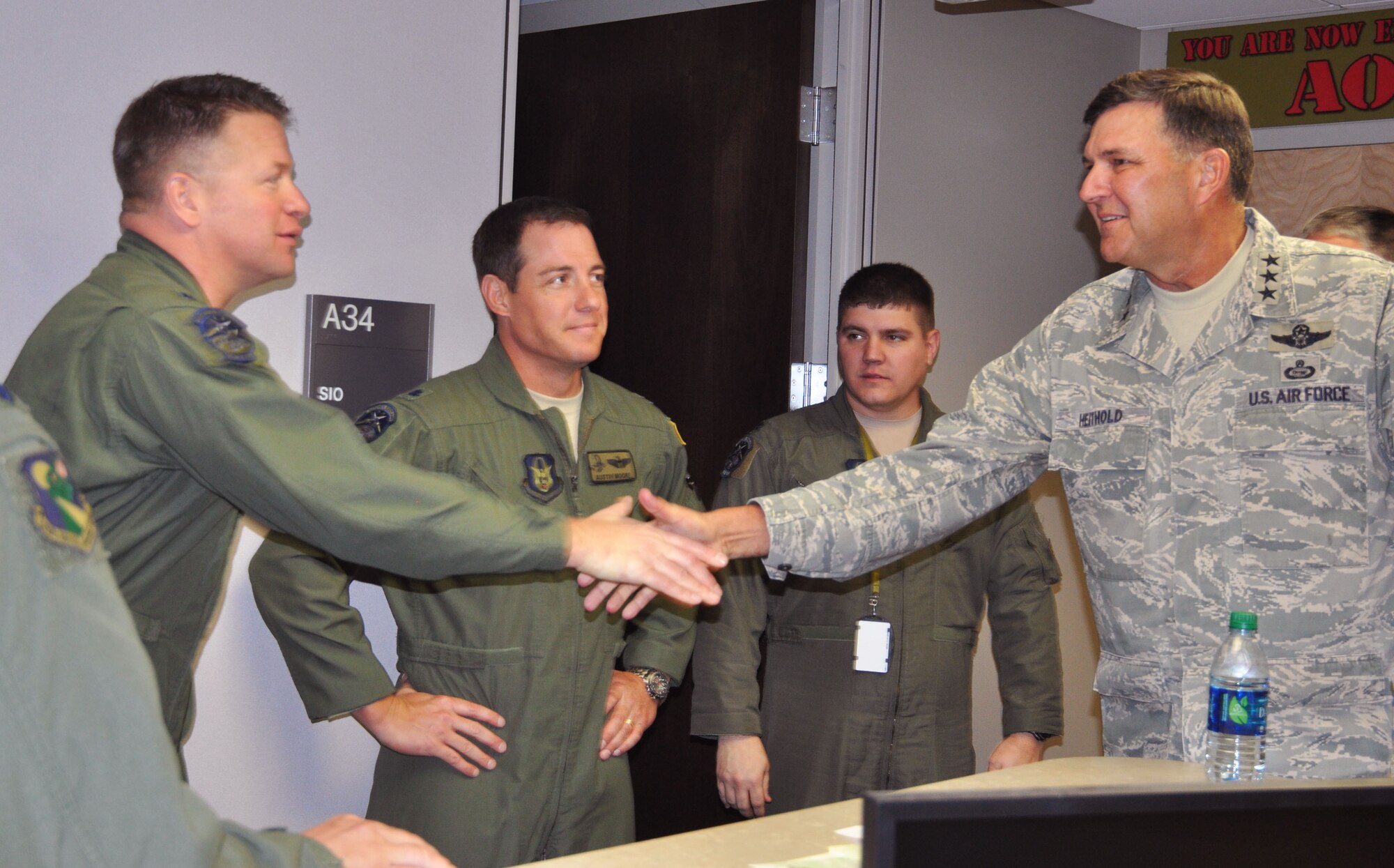Lt. Col. Randal Russell, 2nd Special Operations Squadron commander, welcomes Lt. Gen. Brad Heithold, Air Force Special Operations Command commander, during a recent tour of the Air Force Reserve remotely piloted aircraft unit at Hurlburt Field, Fla.   Russell gave the general an
update on the 919th Special Operations Wing unit's mission and introduced him to the Airmen who employ the MQ-9 Reaper remotely piloted aircraft in a geographically separated classic association with the 27th Special Operations Wing at Cannon AFB, N.M. (U.S. Air Force photo/Dan Neely)
