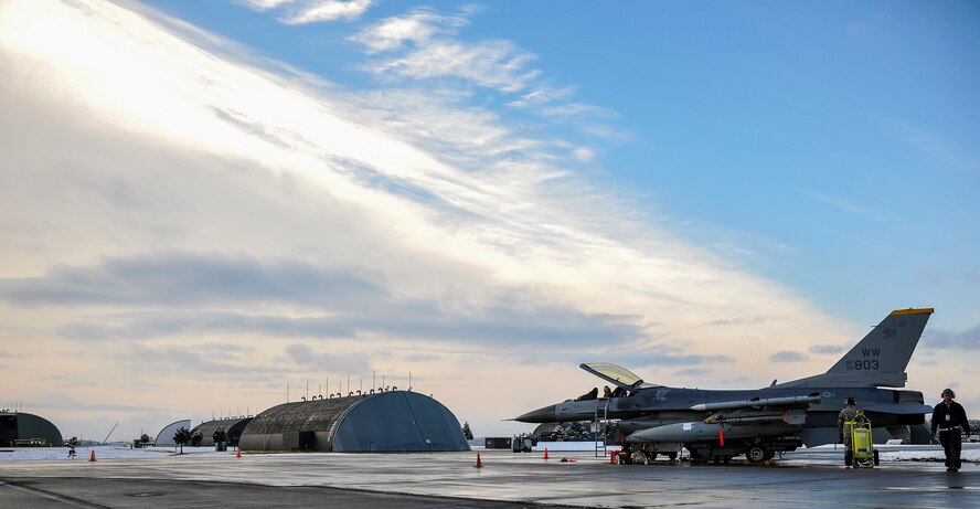 Airmen from the 35th Maintenance Group prepare an F-16 Fighting Falcon for exercise Beverly Sunrise 15-1 at Misawa Air Base, Japan, Dec. 4, 2014. Flightline operation tempo, including aircraft generation, was increased because of the exercise being conducted throughout multiple wings of Pacific Air Forces. Beverly Sunrise 15-1 is a revamped exercise designed and planned after the latest Inspector General visit throughout PACAF. (U.S. Air Force photo by Airman 1st Class Patrick S. Ciccarone/Released)