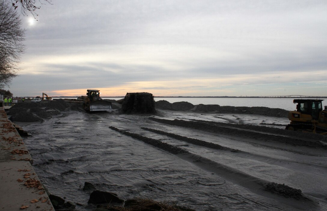 The U.S. Army Corps of Engineers and its contractor Great Lakes Dredge & Dock Company construct a berm system at Oakwood Beach, N.J in December of 2014. The project involves pumping approximately 350,000 cubic yards of sand from the Delaware onto the beach. Work is designed to reduce damages from future storm events and was funded through the Hurricane Sandy Relief Bill (PL 113-2).