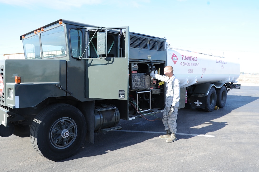 Senior Airman Jacob Hartman checks out the newly painted R-11 refueling truck at the Logistic Readiness Squadron vehicle yard at Luke Air Force Base, Ariz. After receiving waiver approval from the Air Education and Training Command, the 56th LRS had the fuel tank painted white to keep the fuel inside from overheating. The changes to the truck were made because the F-35 Lightning II has a fuel temperature threshold and cannot function properly if the fuel temperature is too high. Hartman is a 56th LRS fuels distribution operator (U.S. Air Force photo/Staff Sgt. Luther Mitchell Jr.)