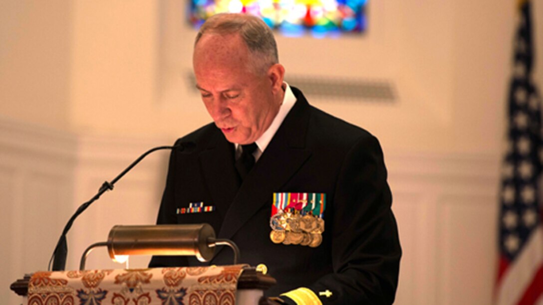 Rear Adm. Brent Scott, 19th Chaplain of the Marine Corps, speaks about Capt. Eli Takesian, the eighth Chaplain of the Marine Corps, during a final rites mass for Takesian at the Old Post Chapel at Fort Meyer, Va. on Dec. 4, 2014. Takesian died May 20, 2014 at the Walter Reed National Military Medical Center in Bethesda, Md. Takesian is most renowned for the care and aid he provided to the Marines of 1st Battalion, 5th Marine Regiment at the bloody battle of Hue City during the Vietnam War.