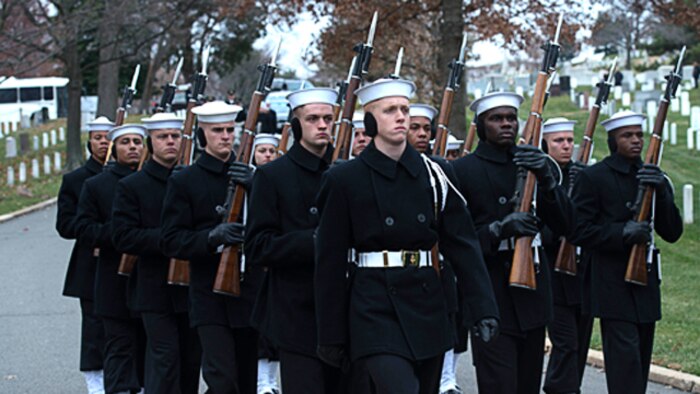 The Navy Honor Guard escorts Capt. Eli Takesian’s remains to his burial in Arlington National Cemetery, Arlington, Va. on Dec. 4, 2014. Takesian, who served as the eighth Chaplain of the Marine Corps, died May 20, 2014 at the Walter Reed National Military Medical Center in Bethesda, Md. Takesian is most renowned for the care and aid he provided to the Marines of 1st Battalion, 5th Marine Regiment at the bloody battle of Hue City during the Vietnam War.