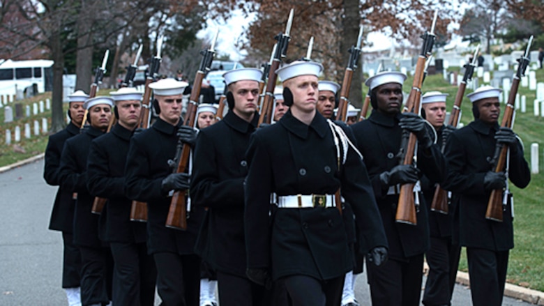 The Navy Honor Guard escorts Capt. Eli Takesian’s remains to his burial in Arlington National Cemetery, Arlington, Va. on Dec. 4, 2014. Takesian, who served as the eighth Chaplain of the Marine Corps, died May 20, 2014 at the Walter Reed National Military Medical Center in Bethesda, Md. Takesian is most renowned for the care and aid he provided to the Marines of 1st Battalion, 5th Marine Regiment at the bloody battle of Hue City during the Vietnam War.