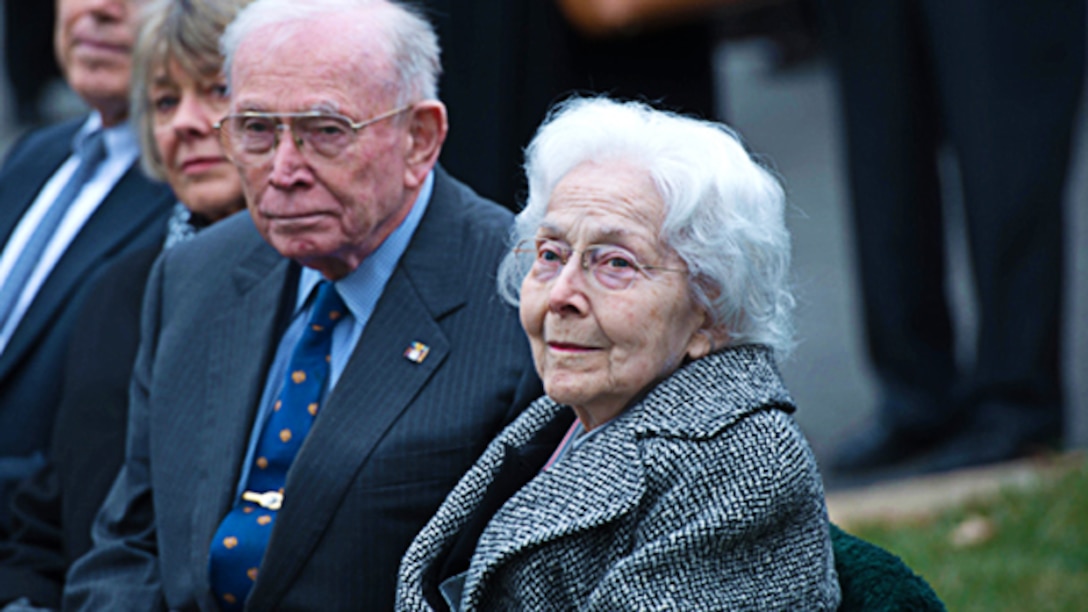 Margaret Takesian, wife of the late Capt. Eli Takesian, the eighth Chaplain of the Marine Corps, listens to a speech from Rear Adm. Brent Scott, the 19th Chaplain of the Marine Corps, during her husband’s burial at the Arlington National Cemetery, Arlington, Va. on Dec. 4, 2014. Takesian died May 20, 2014 at the Walter Reed National Military Medical Center in Bethesda, Md. Takesian is most renowned for the care and aid he provided to the Marines of 1st Battalion, 5th Marine Regiment at the bloody battle of Hue City during the Vietnam War.
