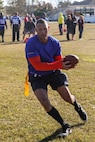 Sergeant Maj. Alex Dobson, the regimental sergeant major of Combat Logistics Regiment 25, 2nd Marine Logistics Group, carries the football during the CLR-25 Turkey Bowl aboard Marine Corps Base Camp Lejeune, N.C., Nov. 21, 2014. The Turkey Bowl was organized to promote esprit de corps and strengthen unit cohesion. (U.S. Marine Corps photo by Pfc. Immanuel Johnson/released)