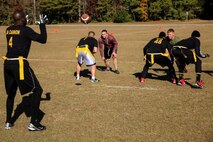 Marines with Combat Logistics Regiment 25, 2nd Marine Logistics Group, play flag football during the CLR-25 Turkey Bowl aboard Marine Corps Base Camp Lejeune, N.C., Nov. 21, 2014. The CLR-25 command staff created and planned the inaugural Turkey Bowl and hope to continue the tradition in the future.