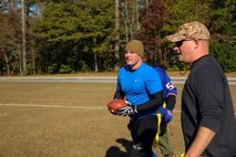 Sergeant Jason Hile (center), a Marine with Combat Logistics Regiment 25, 2nd Marine Logistics Group, scores a touchdown during the CLR-25 Turkey Bowl aboard Marine Corps Base Camp Lejeune, N.C., Nov. 21, 2014. Marines, sailors and family members gathered for a day of fun and camaraderie during the unit’s inaugural Thanksgiving Turkey Bowl.