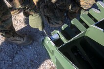 Marines with 8th Engineer Support Battalion, 2nd Marine Logistics Group use a clip to secure part of a 12-bay, double-story, medium-girder bridge at Landing Zone Dove on Marine Corps Base Camp Lejeune, N.C., Nov. 19, 2014.  Approximately 25 Marines constructed the bridge, able to support the weight of a tank, in under six hours. The training reinforced skills learned at Marine Corps combat engineering school.