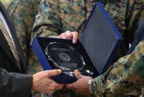 Marines with 2nd Supply Battalion, Combat Logistics Regiment 25, 2nd Marine Logistics Group, are awarded the Department of Defense 2013 Packing Achievement Award during a ceremony aboard Camp Lejeune, N.C., Dec. 3, 2014. This is the first time the battalion has received this highly-competitive award, which has been around for roughly 17 years.