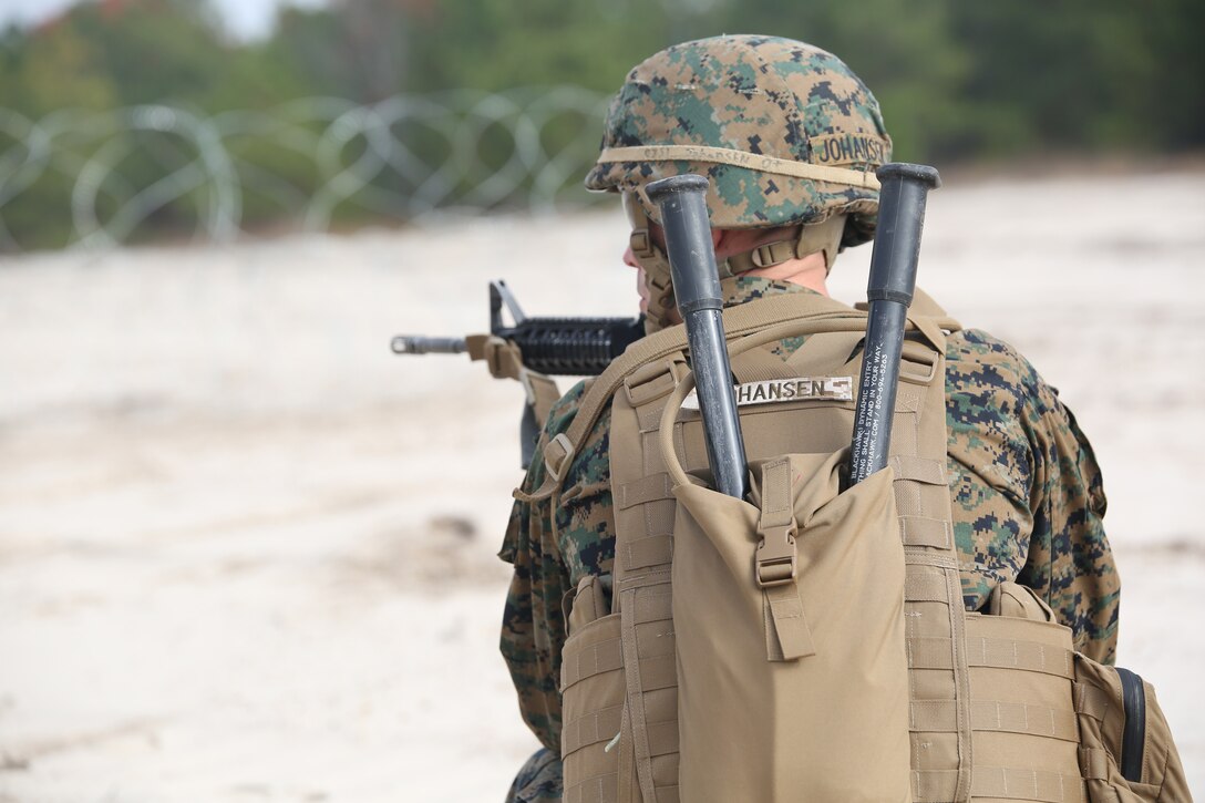 Sgt. Eric T. Johansen, squad leader with Engineer Platoon, Headquarters and Service Company, Ground Combat Element Integrated Task Force, provides security during an assault breaching exercise at Engineer Training Area 2 at Marine Corps Base Camp Lejeune, North Carolina, Dec. 3, 2014. (U.S. Marine Corps photo by Cpl. Paul S. Martinez/Released)