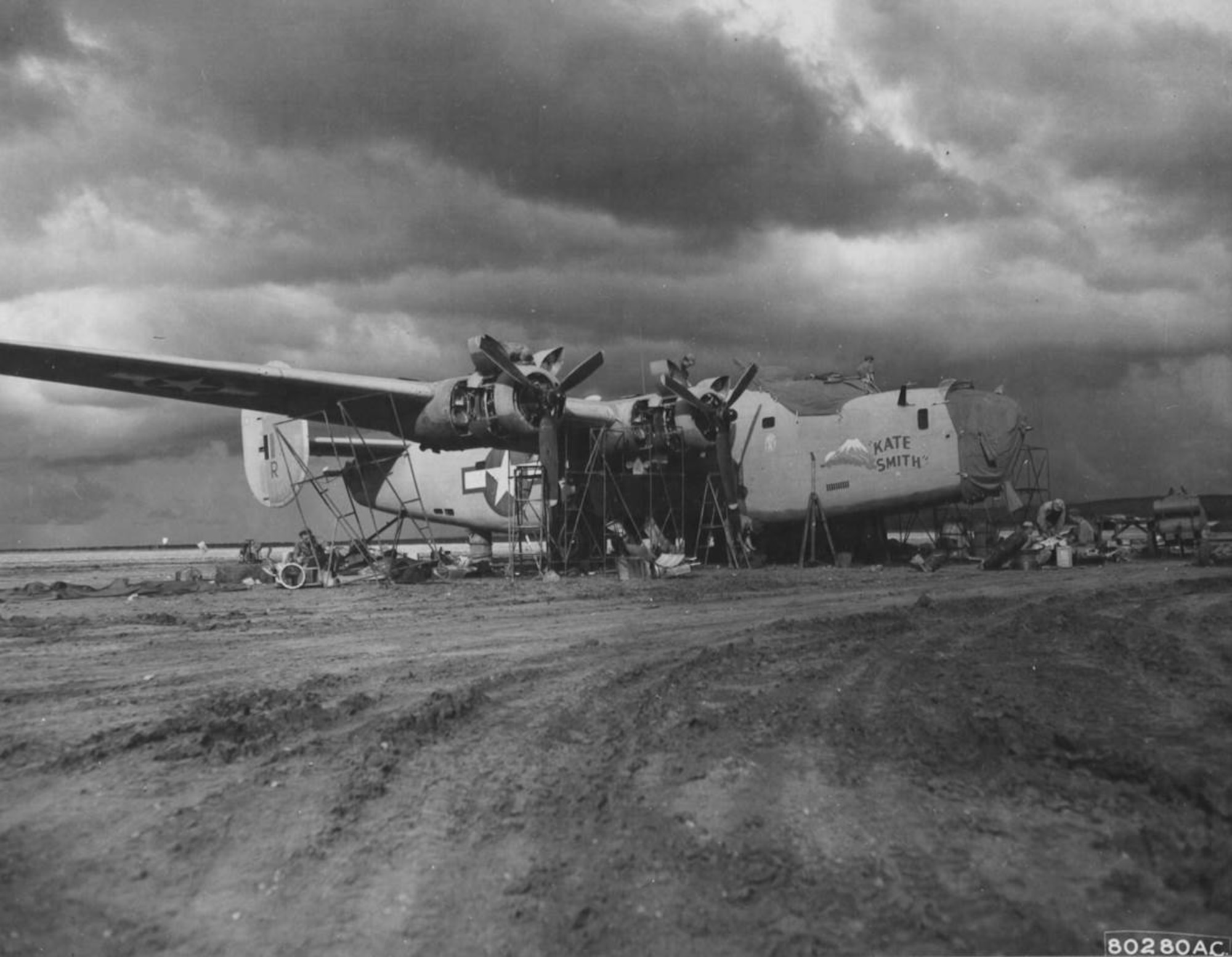 The 43rd Service Group found itself a long way from Portland, Oregon as World War II transpired.  Here a Consolidated B-24D-85-CO Liberator heavy bomber, serial number 42-40654, “KATE SMITH” of the 345th Bombardment Squadron, 98th Bomb Group, is overhauled by men of the 43rd Service Group at an airfield near Benghazi, Cyrenaica, Libya, circa the summer of 1943.  (USAAF Photo)