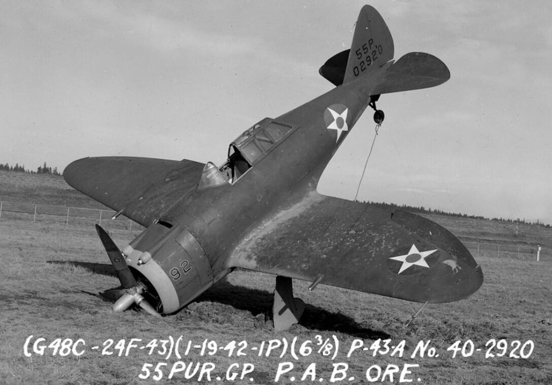 Republic P-43A Lancer nose-over in the sod at Portland AAB, 19 January 1942.  Note the visual characteristics of the P-43 which would be carried forth into the Republic P-47 Thunderbolt design, as seen in the shape of the wings and the “razorback” style canopy and angled shape of the windscreen.  The “55P” on the tail indicates assignment to the 55th Pursuit Group, and the aircraft serial number is carried immediately below.  The number “92” suggests assignment to a high numbered squadron in the group, perhaps the 54th Pursuit Squadron.  (Courtesy Mr. Jack Cook)