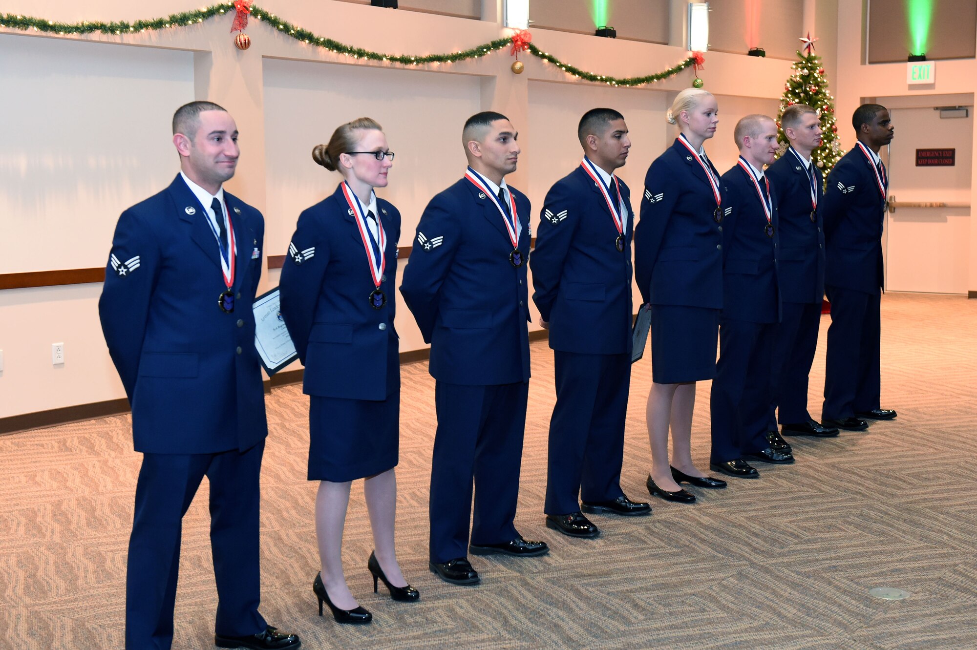 Buckley Airman Leadership School Class 15-A stands together graduating Dec. 4, 2014, at the Leadership Development Center on Buckley Air Force Base, Colo. This graduation represents an important part of the enlisted force professional military education, teaching valuable skills required for supervisors. (U.S. Air Force photo by Airman 1st Class Emily E. Amyotte/Released)