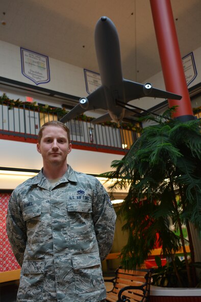 Staff Sgt. Joseph Hymel, 60th Maintenance Group maintenance qualification and training program NCO in charge of KC-10 Extender instructors, stands in the lobby of the 60th MXG building Dec. 1, 2014, at Travis Air Force Base, California. (U.S. Air Force photo by Nick DeCicco)