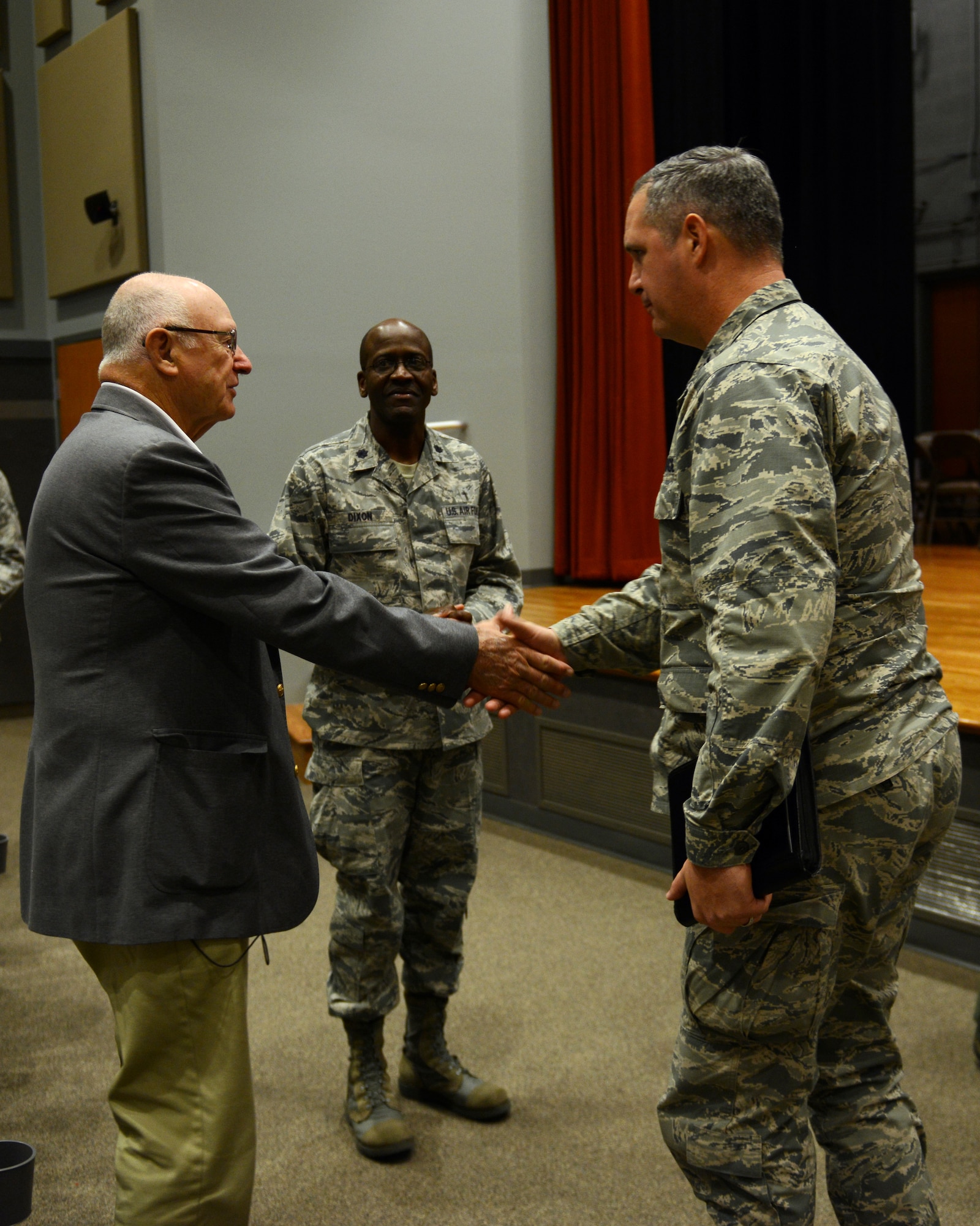 U.S. Air Force Col. Steven Beasley, 7th Bomb Wing vice commander, greets Rev. Bill Libby, McMurry assistant professor of religion, Nov. 24, 2014, at Dyess Air Force Base, Texas. Libby, a retired U.S. Army chaplain, spoke about his personal loss and tragedy during a Comprehensive Airman Fitness brief, which highlighted spiritual resiliency. (U.S. Air Force photo by Airman 1st Class Kedesha Pennant/Released)