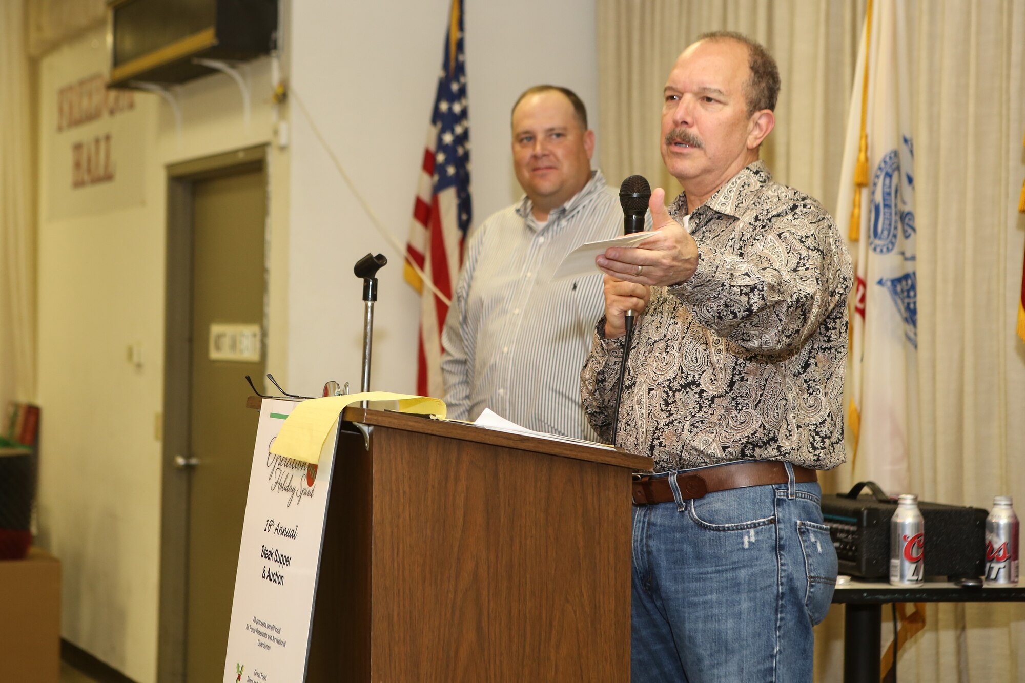 A local businessman announces a donation to Operation Holiday Spirit as organizer Joe Wade looks on November 1 at the Del City American Legion. OHS is a non-profit organization that raises support for local Reserve and Guard Airmen in need. (U.S. Air Force photo/Staff Sgt. Caleb Wanzer)