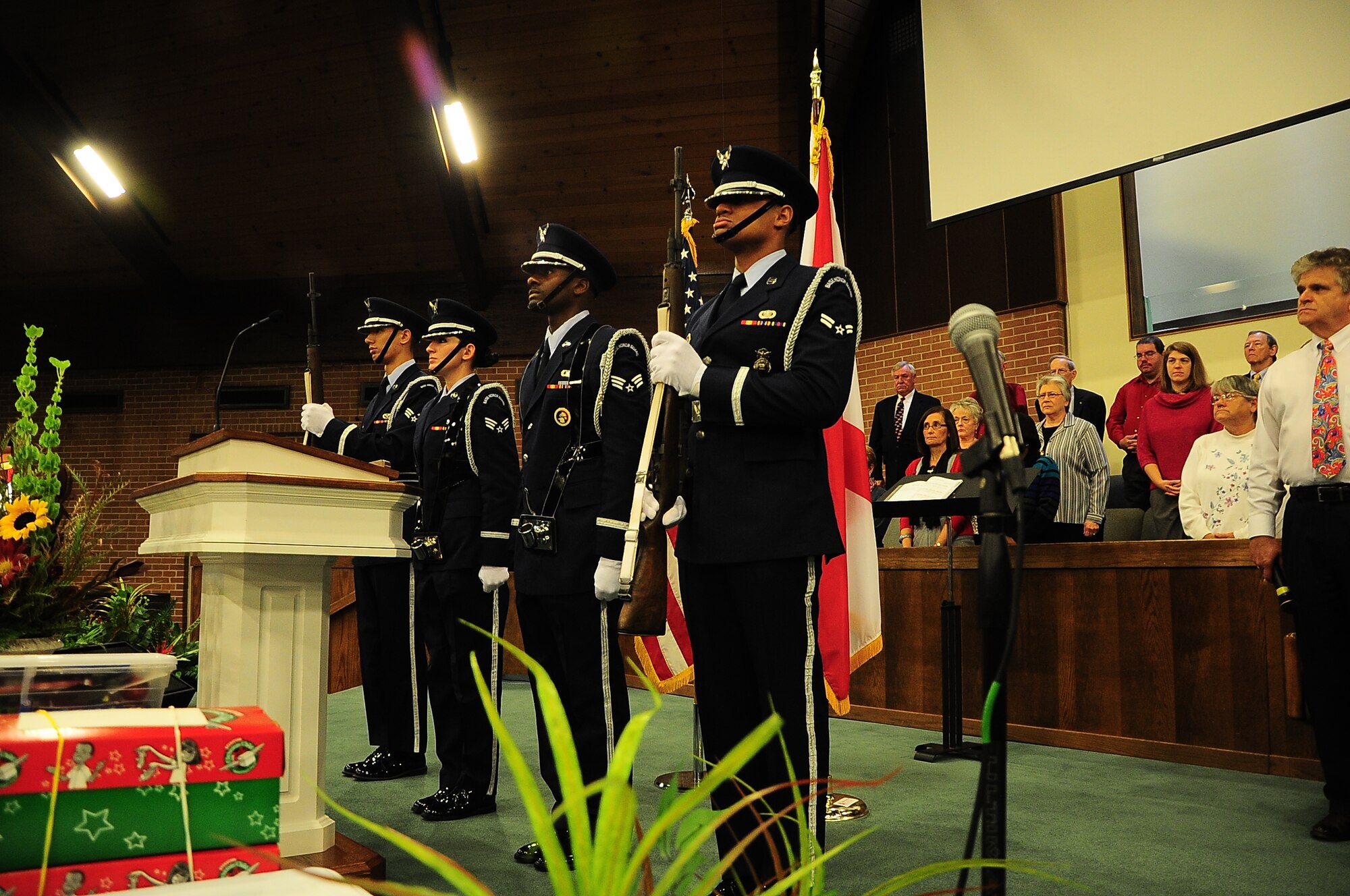 Columbus Air Force Base Honor Guardsmen present arms during a posting of colors at a Veterans Day appreciation service Nov. 9 in Guin, Ala. In addition to posting Colors, Honor Guard performs at military funerals, parades, Change of Command ceremonies, banquets and more. (U.S. Air Force photo/Airman John Day) 