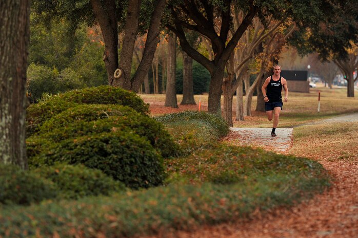 Airman 1st Class Beau McRoberts, a crew chief with the 437th Maintenance Squadron, races to the finish line during the monthly fitness challenge on Joint Base Charleston, S.C., Dec. 5, 2014. McRoberts placed 2nd with a time of 18:22. (U.S. Air Force photo/Staff Sgt. Renae Pittman)