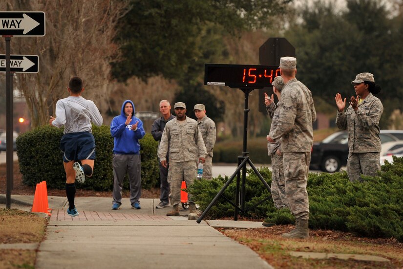 U.S. Air Force 2nd Lt. John Montes, the officer in charge of material management operations in the 628th Logistics Readiness Squadron, takes first place in a 5k run with a time of 15:46 at Joint Base Charleston, S.C., Dec. 5, 2014. The 5k was this month's fitness challenge which is a 628th Air Base Wing initiative intended to encourage teamwork and camaraderie as part of Comprehensive Airmen Fitness. (U.S. Air Force photo/Staff Sgt. Renae Pittman)