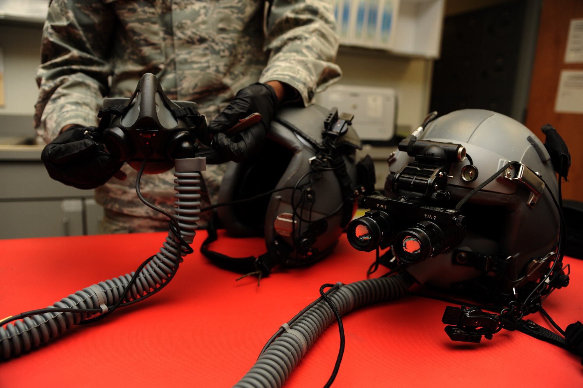 Staff Sgt. Michael McDaniel, the 19th Operations Support Squadron aircrew flight equipment oxygen section noncommissioned officer in charge, assembles a helmet Nov. 25, 2014, at Little Rock Air Force Base, Ark. Helmets are assembled with night vision devices to use for pilots to use during nighttime operations. (U.S. Air Force photo by Airman 1st Class Mercedes Muro) 