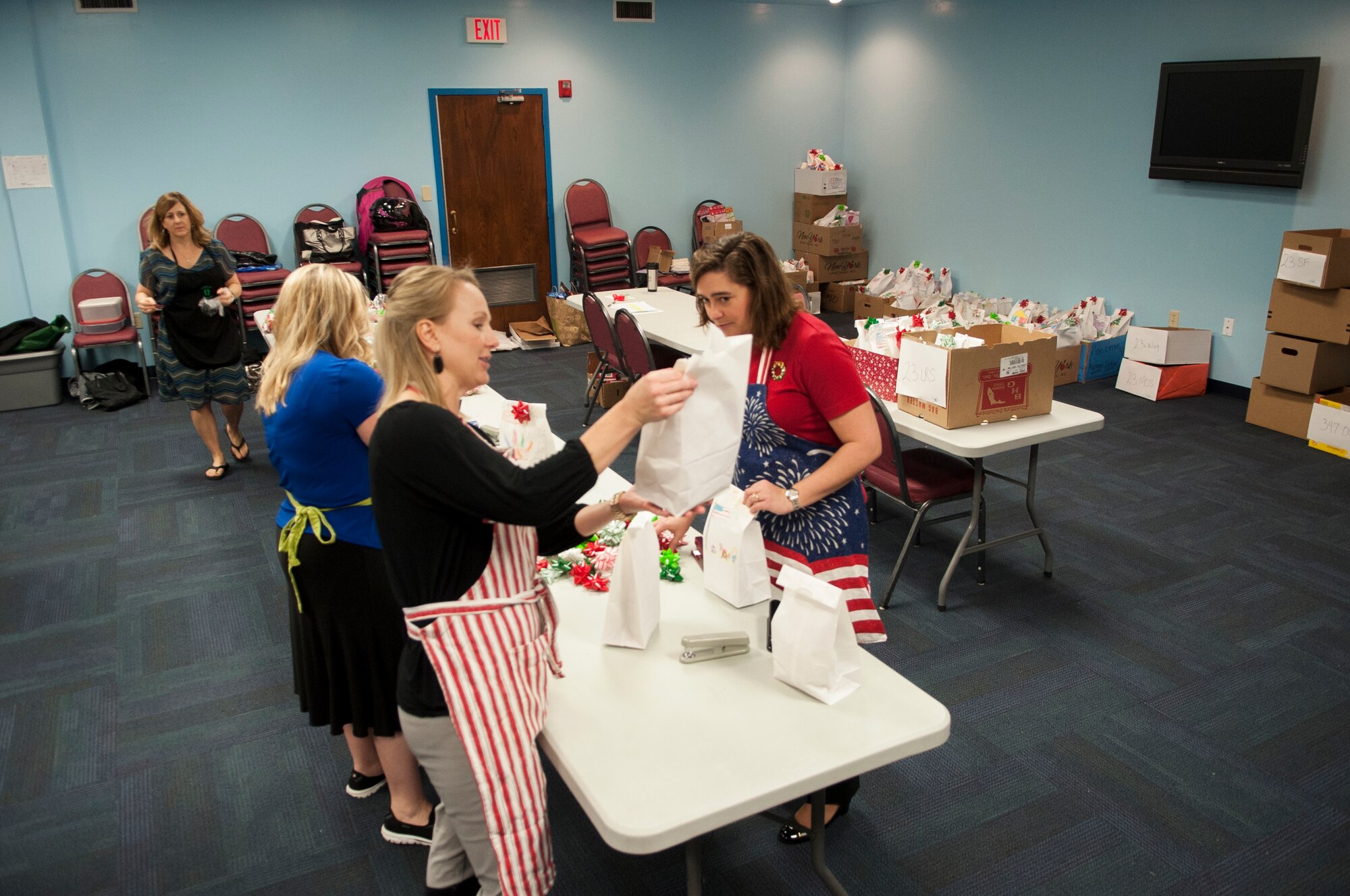 Volunteers select an assortment of cookies for donation during the Airmen Cookie Drive Dec. 3, 2014, at Moody Air Force Base, Ga. Volunteers first donated cookies to dorm residents and distributed the rest throughout the base. (U.S. Air Force photo by Senior Airman Marrero/Released)
