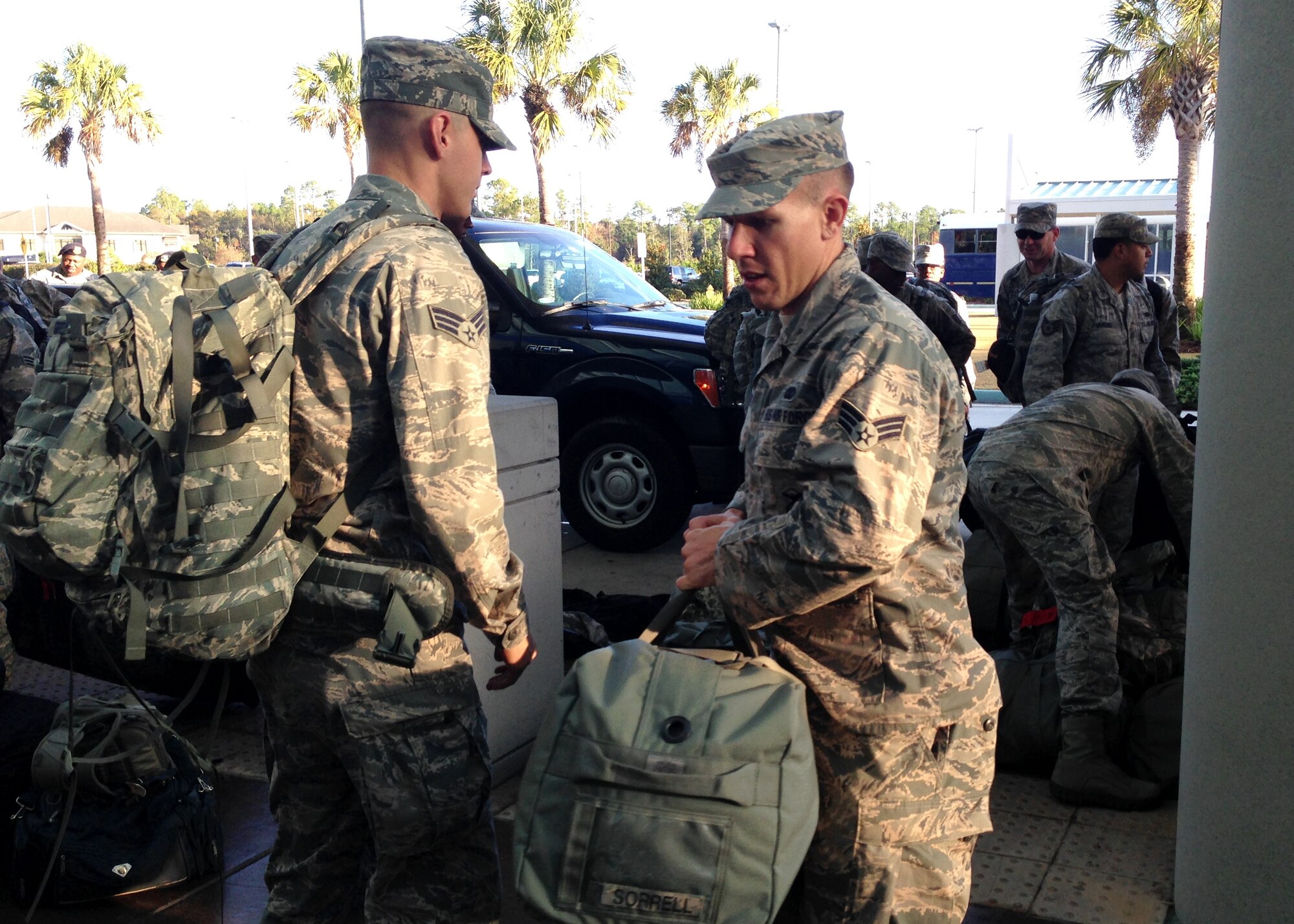 Senior Airman Benton Sorrell, right, and Senior Airman Sebastian Green, with the 403rd Security Forces Squadron at Keesler Air Force Base, Mississippi, depart for pre-deployment training at Creech Air Force Base, Nevada, Dec. 5, 2014.  About 30 Airmen with the 403rd SFS are attending the Base Security Operations Course prior to their deployment to Southwest Asia next month. (U.S. Air Force photo/Maj. Marnee A.C. Losurdo)