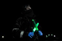 Staff Sgt. Robert Dupree, 25th Aircraft Maintenance Unit dedicated crew chief, marshals an A10 Thunderbolt II pilot Dec. 5, 2014, during Exercise Beverly Bulldog 15-01 at Osan Air Base, Republic of Korea. The exercise focuses on readiness, testing Osan’s wartime procedures, and realistically looking at our ability to defend the base, execute operations and receive follow-on forces. (U.S. Air Force photo by Senior Airman David Owsianka)