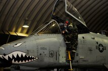 Senior Airman Anton Yakovenko, 25th Aircraft Maintenance Unit avionics journeyman, goes over a ground collision avoidance system malfunction with the pilot Dec. 5, 2014, during Exercise Beverly Bulldog 15-01 at Osan Air Base, Republic of Korea. The exercise focuses on readiness, testing Osan’s wartime procedures, and realistically looking at our ability to defend the base, execute operations and receive follow-on forces. The photo has been edited for security purposes. (U.S. Air Force photo by Senior Airman David Owsianka)