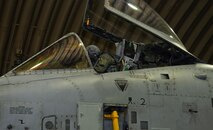 An A10 Thunderbolt II pilot does a pre-flight cockpit inspection Dec. 5, 2014, during Exercise Beverly Bulldog 15-01 at Osan Air Base, Republic of Korea. The exercise focuses on readiness, testing Osan’s wartime procedures, and realistically looking at our ability to defend the base, execute operations and receive follow-on forces. (U.S. Air Force photo by Senior Airman David Owsianka)