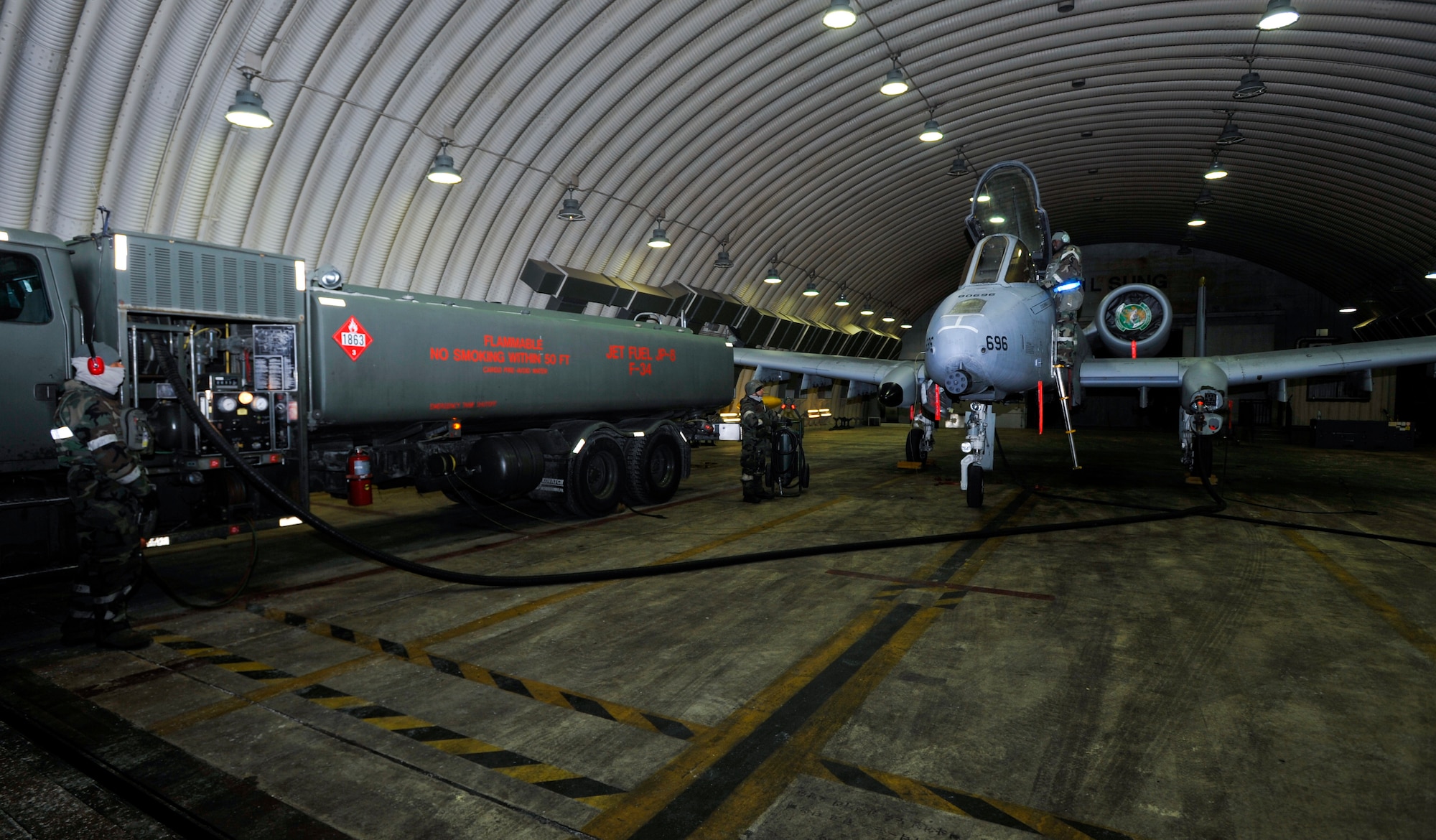 Airmen load fuel into an A10 Thunderbolt II prior to being prepped for launch Dec. 5, 2014, during Exercise Beverly Bulldog 15-01 at Osan Air Base, Republic of Korea. The exercise focuses on readiness, testing Osan’s wartime procedures, and realistically looking at our ability to defend the base, execute operations and receive follow-on forces. (U.S. Air Force photo by Senior Airman David Owsianka)