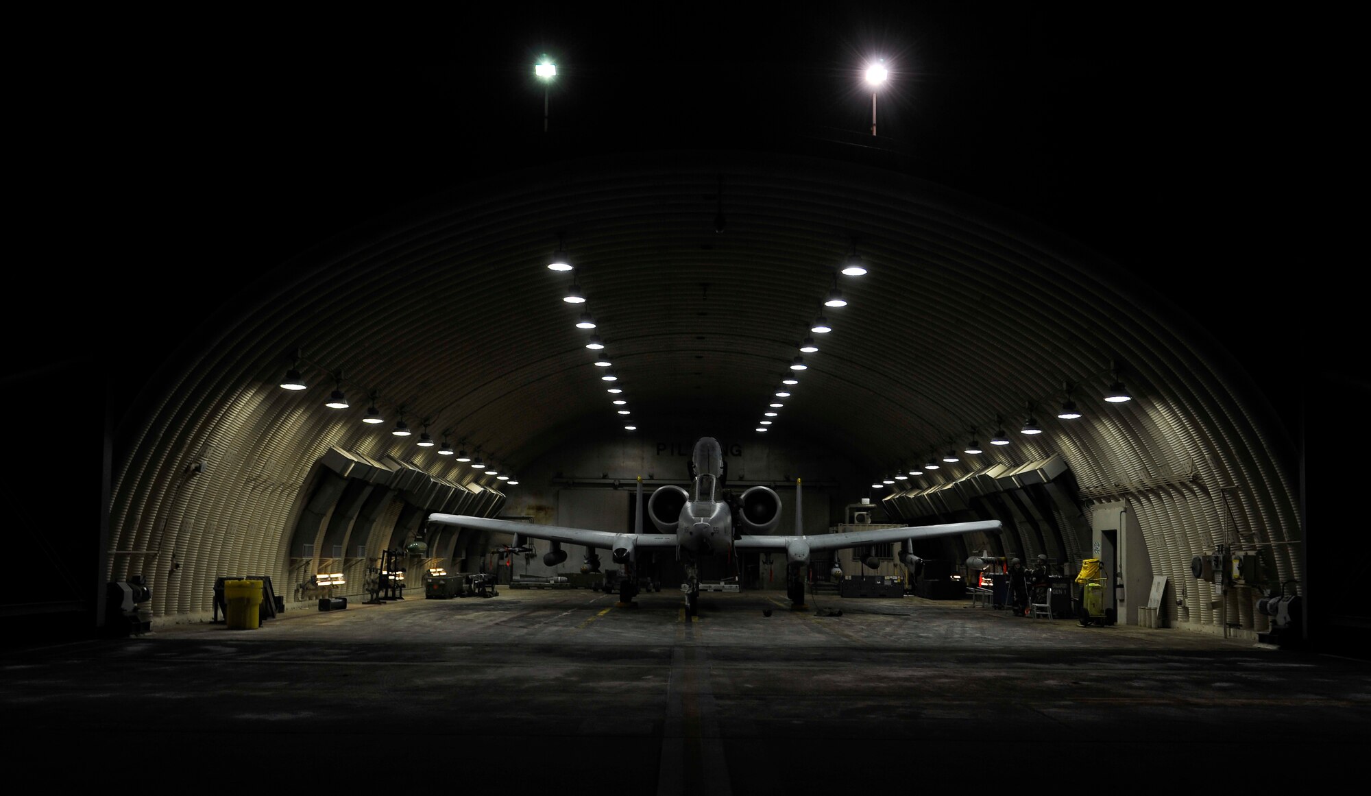 An A10 Thunderbolt II sits in a hangar prior to being prepped for launch Dec. 5, 2014, during Exercise Beverly Bulldog 15-01 at Osan Air Base, Republic of Korea. The exercise focuses on readiness, testing Osan’s wartime procedures and realistically looking at our ability to defend the base, execute operations and receive follow-on forces. (U.S. Air Force photo by Senior Airman David Owsianka)