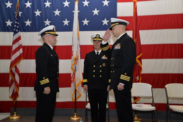 Commander Joseph Cole (right) assumes command of the Naval Consolidated Brig Charleston with a salute to his predecessor, Cmdr. Patrick Boyce, while Rear Adm. David Steindl, Commander, Navy Personnel Command, observes during the NAVCONBRIG change of command ceremony Dec. 5, 2014, onboard the USS Yorktown in Mt. Pleasant, S.C.  Boyce will report to USS Ronald Reagan (CVN 76) where he will assume the duties as the operations officer. Cole was previously the NAVCONBRIG executive officer. (U.S. Air Force photo/Eric Sesit)
 
