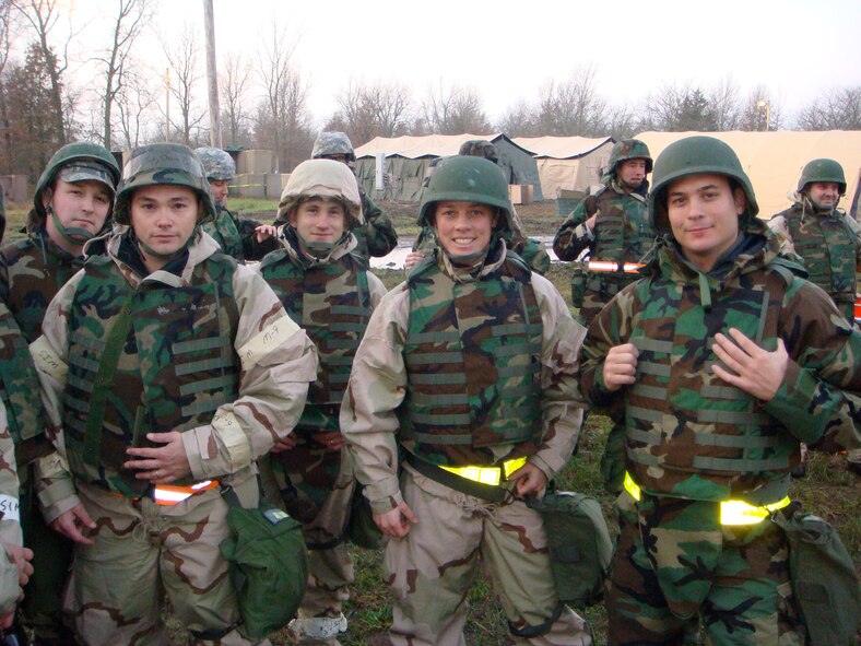 Col. Kristin Goodwin poses for a picture in personal protective equipment (PPE) with fellow Airmen. For Goodwin, taking care of Airmen and their families is the key to effective leadership. (Courtesy photo)