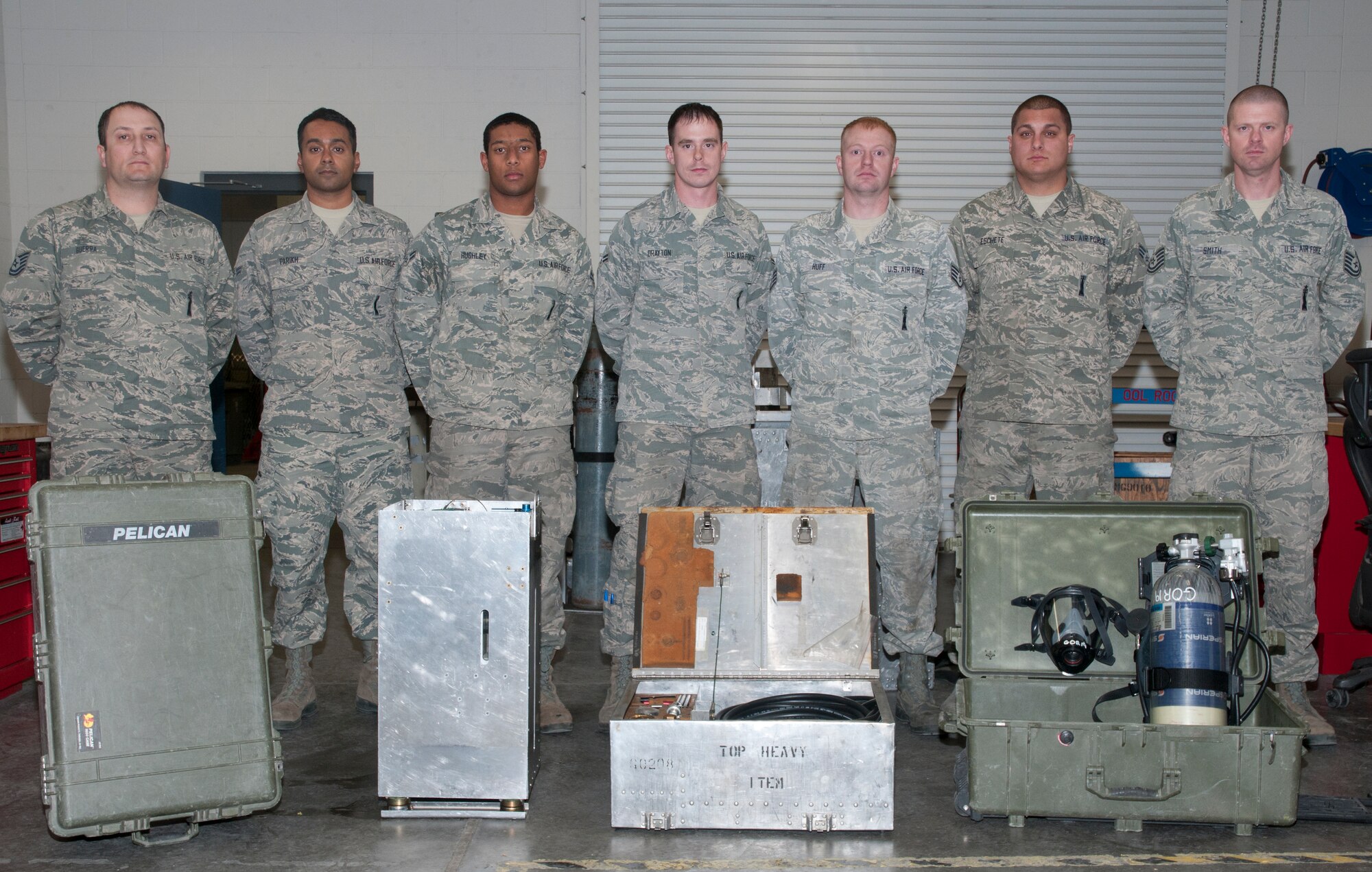 Members of the 90th Missile Maintenance Squadron Survivable Systems Team pose for a photograph Nov. 19 in their back shop in Bldg. 1235. The team consists of former mechanical and pneudraulic section personnel, two of which take on the role as team chiefs. It was formed as a Force Improvement Program initiative  to streamline maintenance in the field.
 (U.S. Air Force photo/ Airman 1st Class Malcolm Mayfield)
