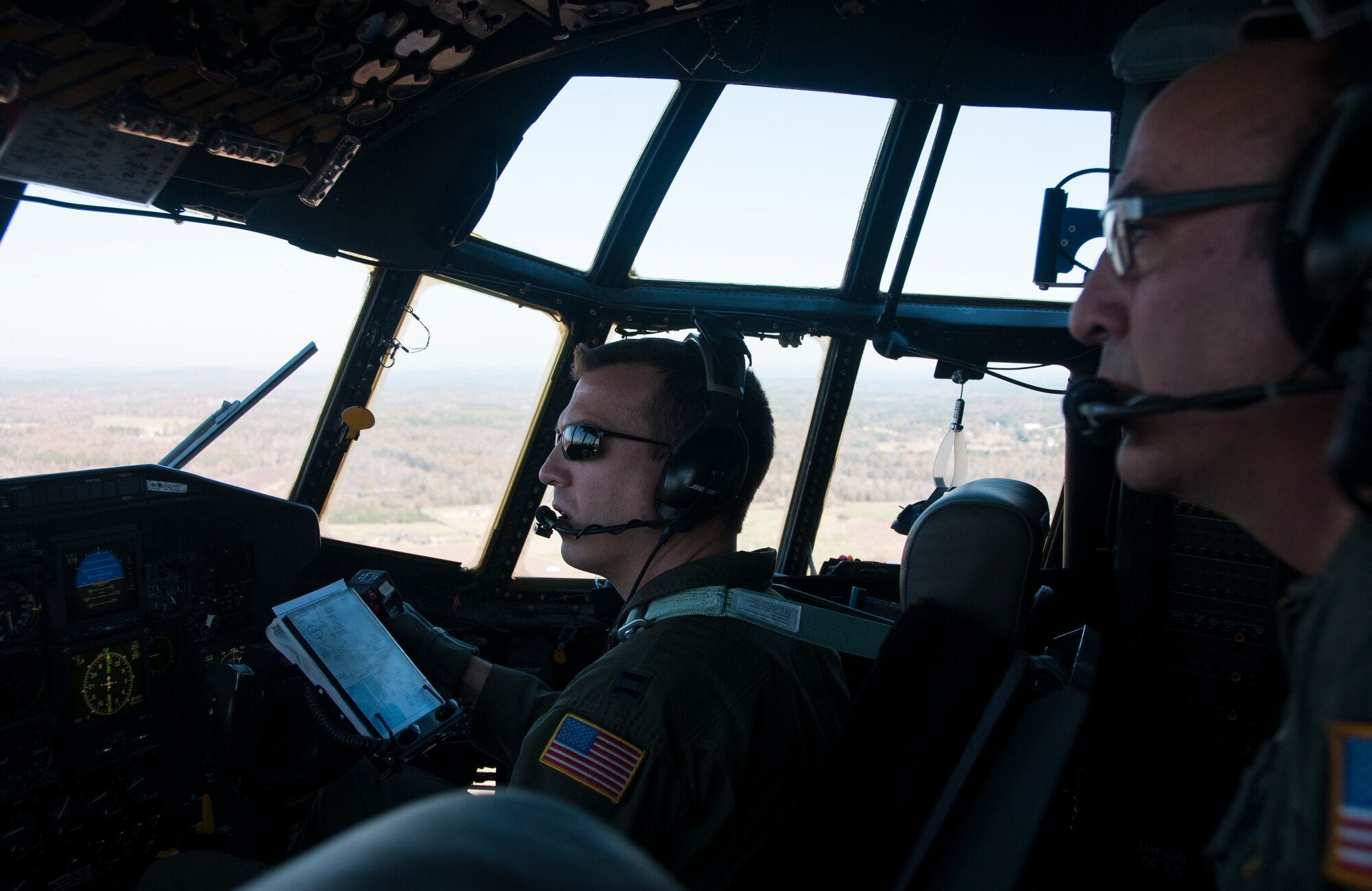 Capt. Mike Edwards, 700th Airlift Squadron C-130 pilot, scans the Georgia horizon during a training exercise Nov. 20, 2014. The 700th Airlift Squadron maintains combat ready aircrews and aircraft capable of deploying in response to worldwide contingencies and emergencies. (U.S. Air Force photo by Senior Airman Daniel Phelps/Released)