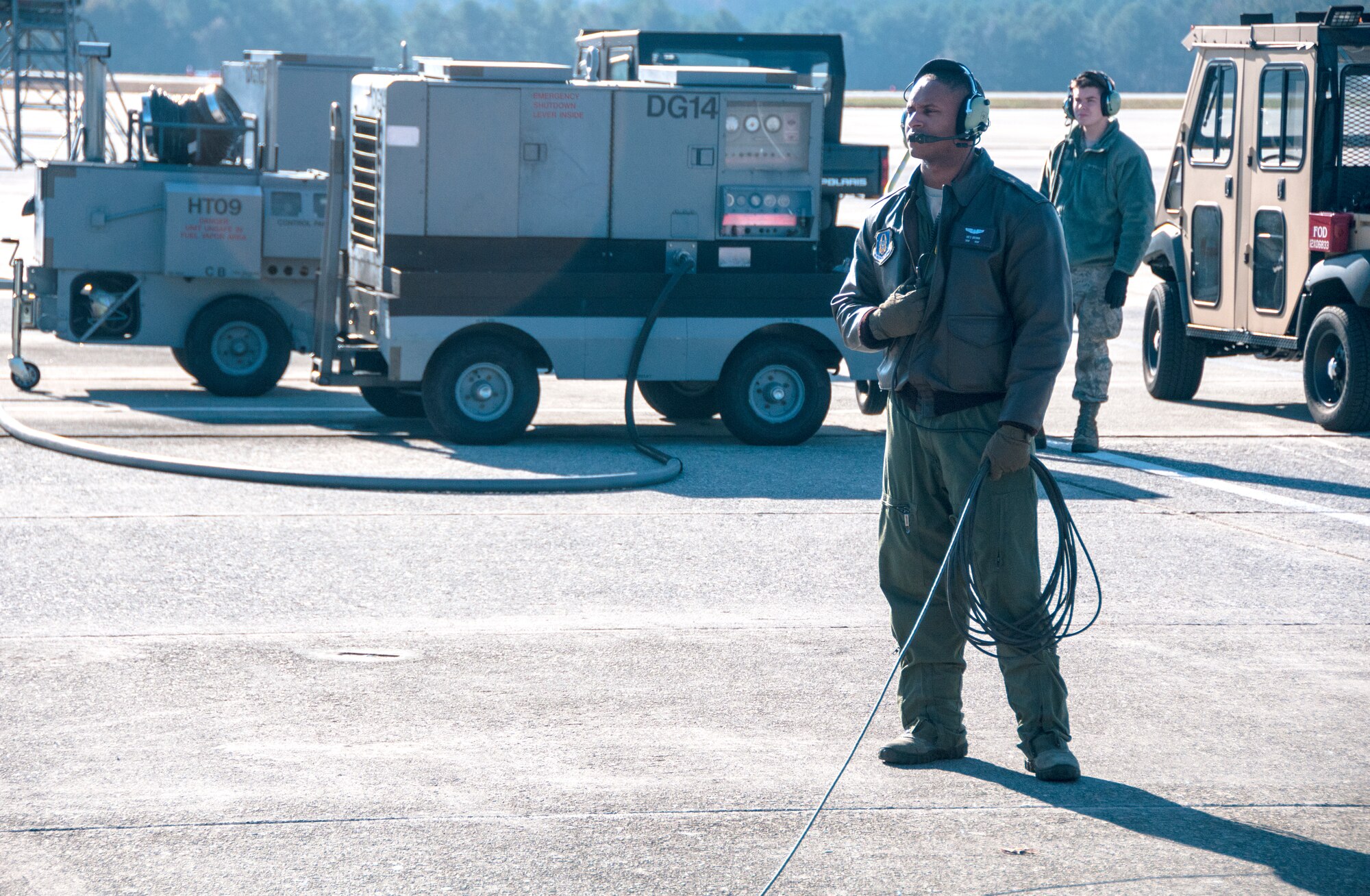 Senior Airman Wes Brown, 700th Airlift Squadron loadmaster, inspects a U.S. Air Force C-130 Hercules prior to take-off Nov. 20, 2014. The 700th Airlift Squadron maintains combat ready aircrews and aircraft capable of deploying in response to worldwide contingencies and emergencies. (U.S. Air Force photo by Senior Airman Daniel Phelps/Released)