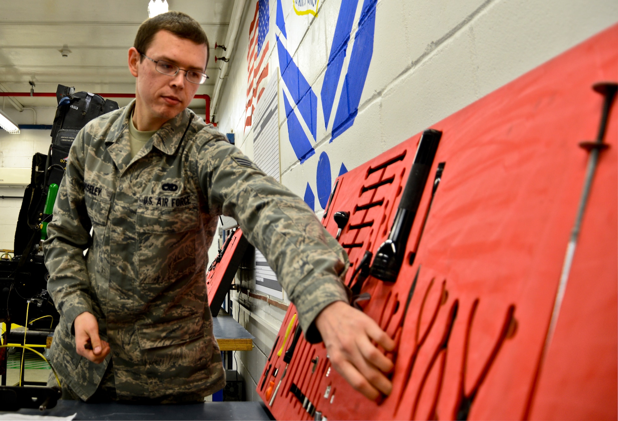 Senior Airman Eric Moseley, 48th Component Maintenance Squadron aircrew egress systems journeyman, prepares to work on an ejection seat rebuild at Royal Air Force Lakenheath, England, Dec. 3, 2014. Moseley was nominated for a Liberty Spotlight because he embodies the core values of Service Before Self and Excellence in All We Do. (U.S. Air Force photo by Airman 1st Class Erin R. Babis/Released)