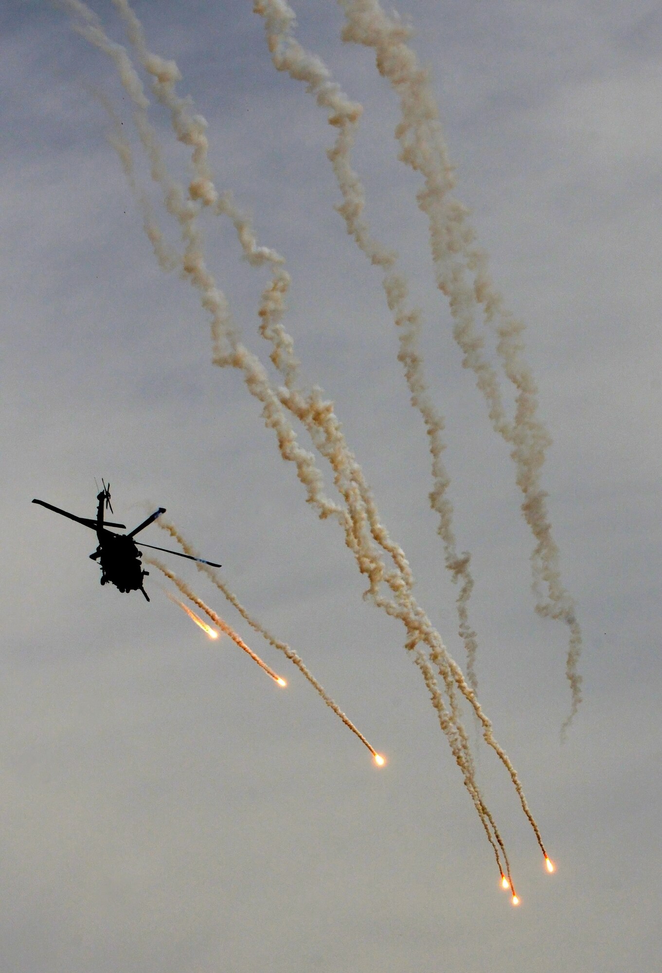 DAVIS-MONTHAN AIR FORCE BASE, Arizona - A Pave Hawk air crew with the 305th Rescue Squadron of the Air Force Reserve at Davis-Monthan AFB, AZ practices live fire over the Arizona desert in March of 2014. The 305th RQS trains personnel, with equipment, to achieve and maintain the capability to perform day/night combat rescue missions; search for, locate and recover United States Air Force and other Department of Defense personnel involved with United States defense activities. . (U.S. Air Force photo/Tech. Sgt. Frank Oliver)